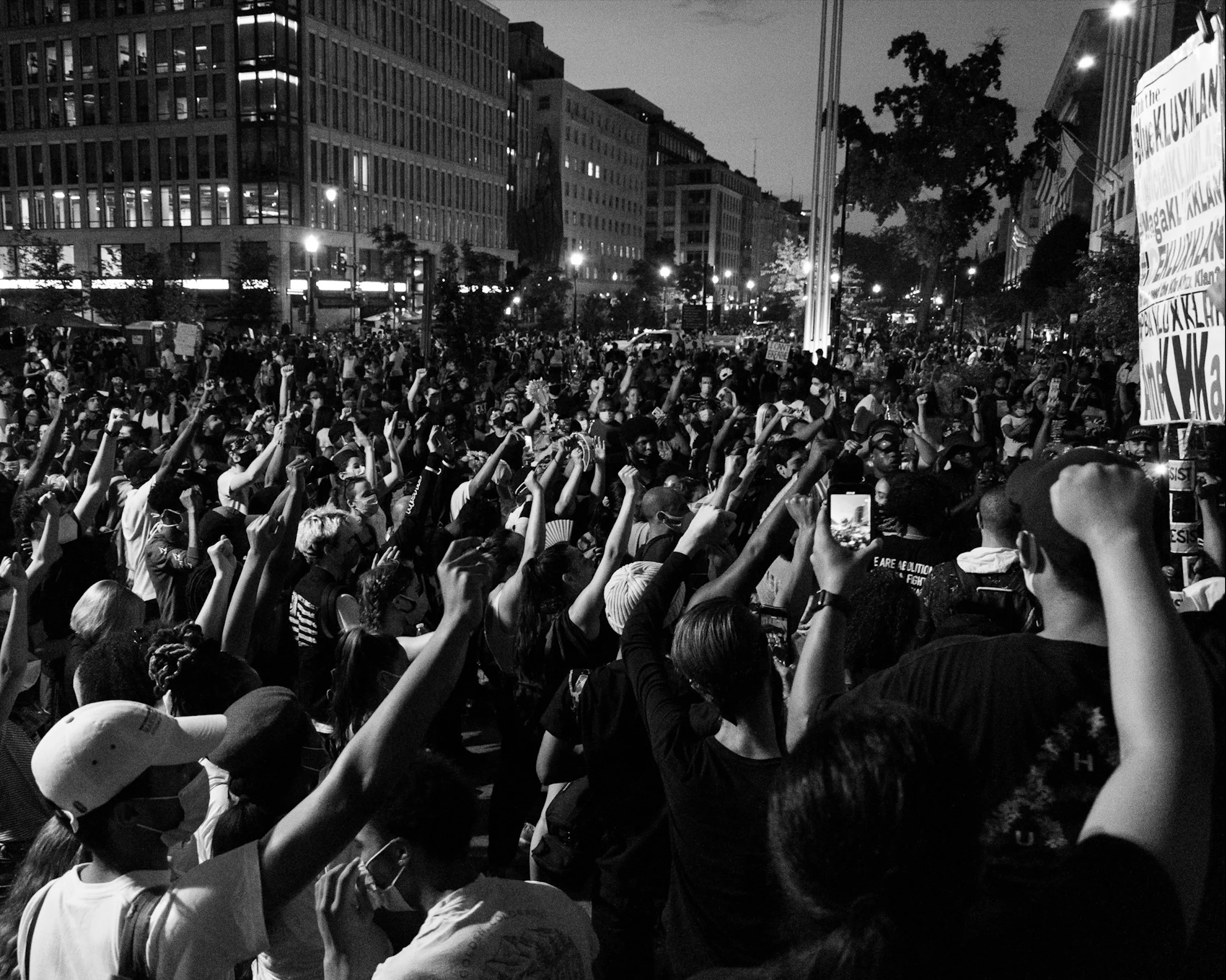A decorative header image of a crowd protesting
